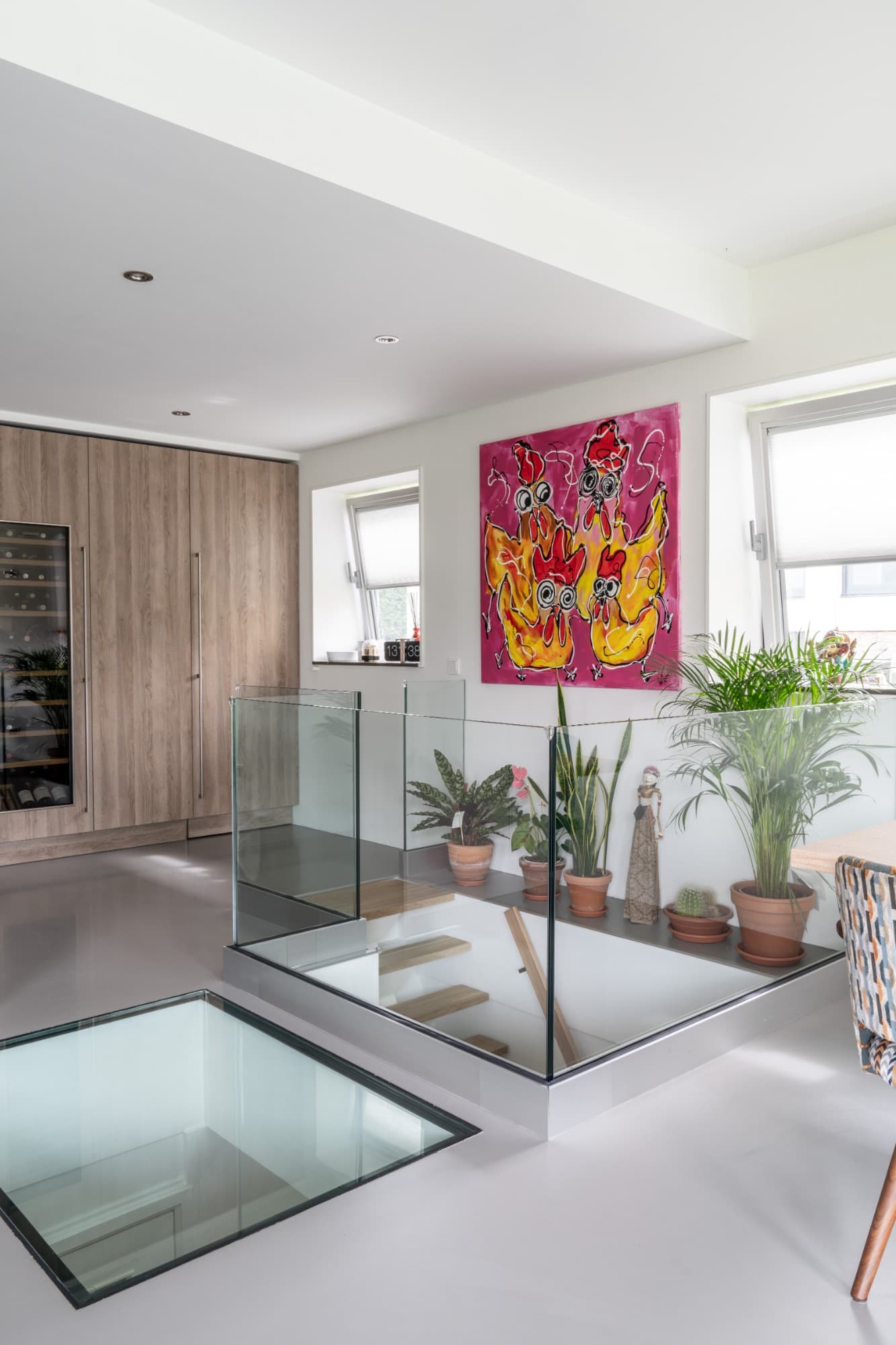 Trapgat met glas en beloopbare glasplaat in de keuken, Amsterdam